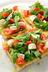 Focaccia with tomatoes, rocket and mozzarella