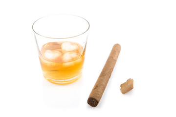 Cigar and glass of whiskey with ice