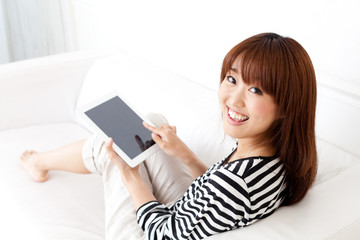 attractive asian woman using tablet computer