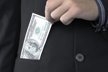 Businessman holding 100 dollars