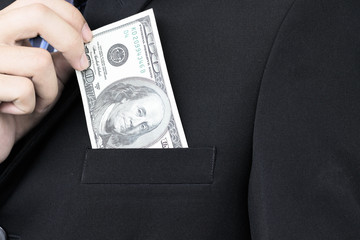 Businessman holding 100 dollars