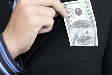 Businessman holding 100 dollars