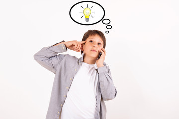 Kid with mobile phone and idea