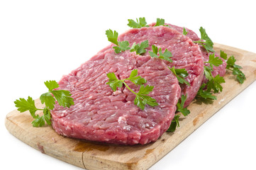 Hamburger of beef on wooden board