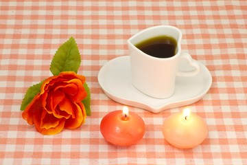 Fototapeta na wymiar rose and candles and coffee