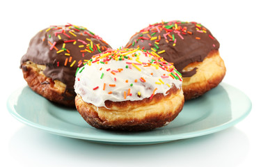 Tasty donuts on color plate isolated on white