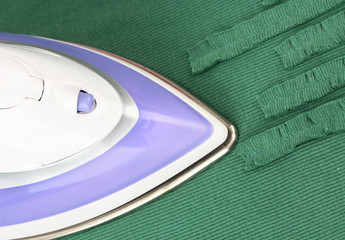 Ironing color textile, close up