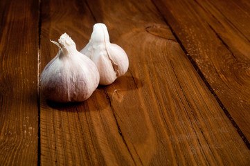 Organic garlic on a wooden background