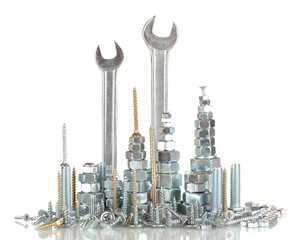 Many types of metal bolts, screws, nuts and wrenches isolated