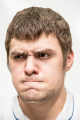 grimace on his face