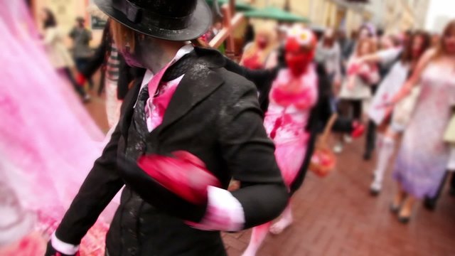 Bloody zombies crowd walk include newlyweds and bridesmaid