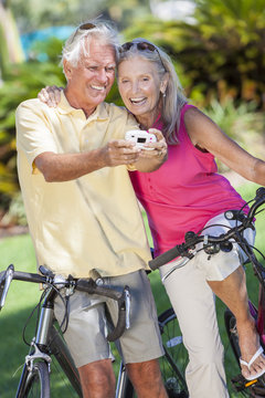 Senior Couple Bicycles Taking Digital Camera Picture