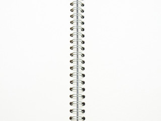 open spiral binding notebook on white