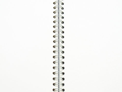 open spiral binding notebook on white