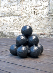 Cannonbals in display inside an old fort in Florida.
