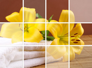 Composition of beautiful yellow flowers and white towels