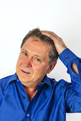 Fototapeta premium Portrait of a handsome older man looking and smiling