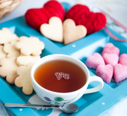 Valentine cookies, sugar in the shape of heart and cup of tea