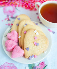 vanilla cookies with sugar and cup of tea