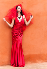 Beautiful young woman in a red dress