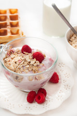 waffles, yogurt with muesli and fruits for breakfast