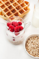 waffles, yogurt with muesli and fruits for breakfast