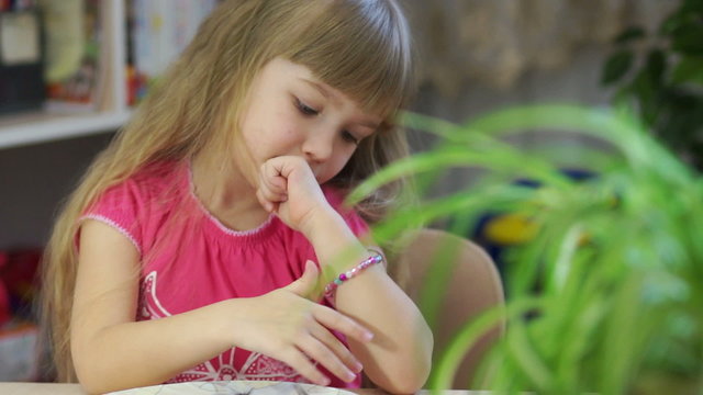 Girl 4s created jewelry for hand beaded