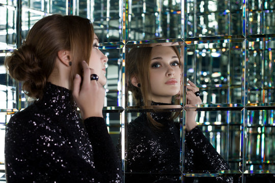 Beautiful Woman In Long Black Dress Near Mirror