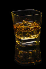 Glass of whisky with ice