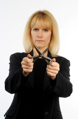 Female executive holding scissors representing corporates cuts