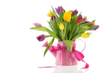 Watering can with bouquet tulips for birthday