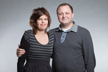 Happy couple in love. Man and woman. Studio shot.
