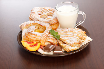 Various cakes and milk breakfast