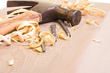 Hammer and nails on a wood board