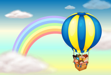A hot air balloon near the rainbow
