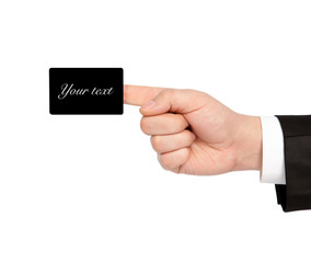 isolated hand of a businessman in a suit holding a business card