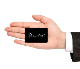 isolated hand of a businessman in a suit holding a business card