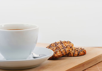 Cup of black coffee with butter biscuit