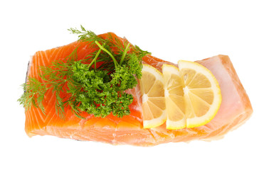 Fresh salmon fillet with herbals and lemon slices, isolated