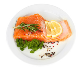Fresh salmon fillet with herbals and lemon slices