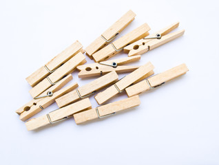Wooden clothes clips isolated on white back ground