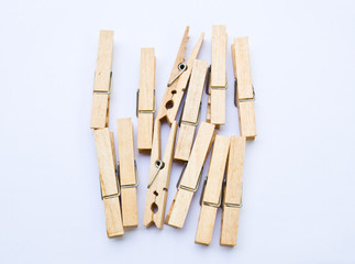 Wooden clothes clips isolated on white back ground