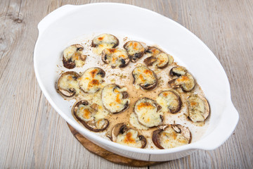 Grilled slices of mushrooms with mozarella cheese