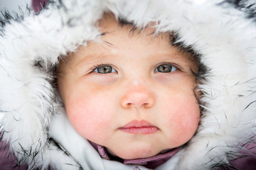 Happy baby on the winter background
