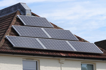 Solar photovoltaic panel array on roof
