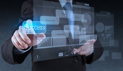 businessman hand pointing to success diagram