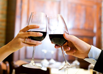 Couple toasting wine glasses