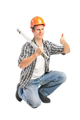 A smiling worker holding a construction bubble level and giving