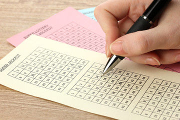 Naklejka premium Closeup of lotto ticket during the marking of numbers,
