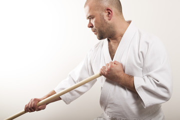 Aikido man with a stick